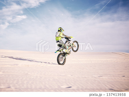 Bike, space and balance with a sports man riding a vehicle in the desert for adventure or adrenaline. Motorcycle, training or freedom and an athlete on sand in nature for skill or power with mockup Bike, space and balance with a sports man riding a vehicle in the desert for adventure or adrenaline. Motorcycle, training or freedom and an athlete on sand in nature for skill or power with mockup 137413938