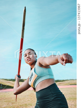Woman, javelin and athlete in competition, practice or sports training in fitness on stadium field. Active female person or athletic competitor throwing spear, poll or stick in distance Woman, javelin and athlete in competition, practice or sports training in fitness on stadium field. Active female person or athletic competitor throwing spear, poll or stick in distance 137413967