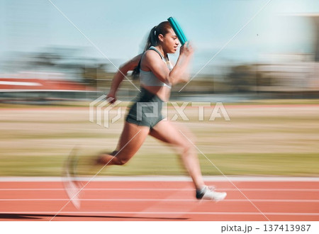 Action, speed and woman athlete running relay sprint in competition for fitness game and training for energy wellness on a track. Sports, stadium and athletic person or runner exercise and workout Action, speed and woman athlete running relay sprint in competition for fitness game and training for energy wellness on a track. Sports, stadium and athletic person or runner exercise and workout 137413987