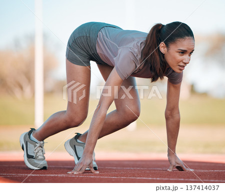 Woman, fitness and running start in athletics, motivation or competition on stadium or track. Active female person or runner ready in sprint marathon, cardio workout or outdoor performance 137414037