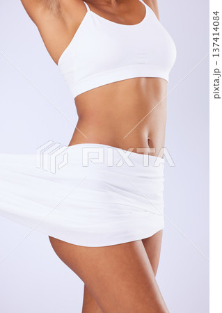 Beauty, material and woman body in studio for epilation, hair removal or self care routine. Health, diet and closeup of slim model figure with silk textile fabric for glow skin by a white background. Beauty, material and woman body in studio for epilation, hair removal or self care routine. Health, diet and closeup of slim model figure with silk textile fabric for glow skin by a white background. 137414084