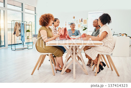 Creative people, fashion design and meeting in brainstorming, team strategy or clothing ideas at office. Group of women designers in retail startup, project plan or teamwork discussion at workplace 137414323