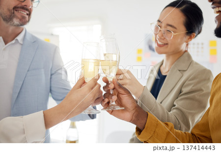 Toast, champagne and party with business people in office for winner, celebration and support. Teamwork, target and friends with employees and cheers for community, achievement and congratulations Toast, champagne and party with business people in office for winner, celebration and support. Teamwork, target and friends with employees and cheers for community, achievement and congratulations 137414443