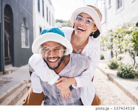Happy couple, love or piggyback portrait in city to travel on romantic date to play a funny outdoor game. Smile, interracial or happy man carrying gen z woman in silly, goofy or playful joke together Happy couple, love or piggyback portrait in city to travel on romantic date to play a funny outdoor game. Smile, interracial or happy man carrying gen z woman in silly, goofy or playful joke together 137414519