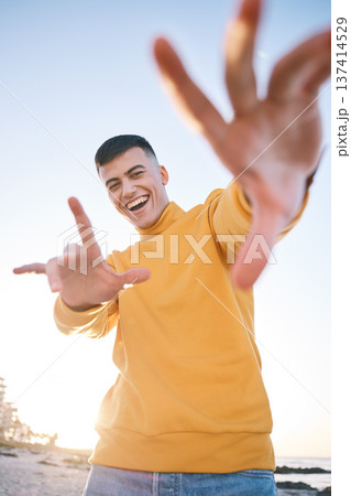 Frame, summer and a man with hands at the beach with happiness, freedom and creativity. Smile, portrait and a young person at the sea with a gesture for perspective on a vacation at the ocean 137414529