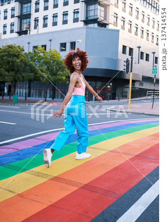 Happy, walking and a woman on a pride street for a celebration of freedom of love. Smile, city and a girl or person in support of lgbt community on a rainbow road for equality, excited and identity Happy, walking and a woman on a pride street for a celebration of freedom of love. Smile, city and a girl or person in support of lgbt community on a rainbow road for equality, excited and identity 137414554