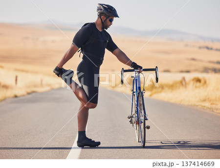 Man, cyclist and stretching on road with bicycle in fitness, training or outdoor sports in countryside. Active male person or athlete in body warm up, leg exercise or preparation in cycling or cardio 137414669