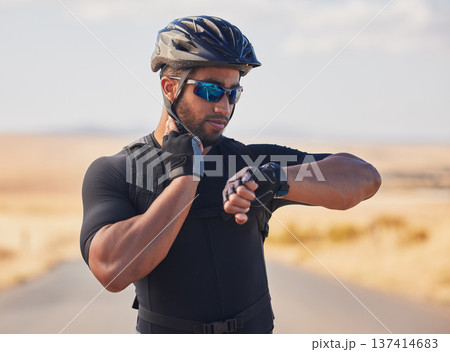 Fitness, cycling and man checking pulse at race, marathon or competition training in nature. Sports, workout and young male athlete timing his heart rate for health at an outdoor cardio exercise. Fitness, cycling and man checking pulse at race, marathon or competition training in nature. Sports, workout and young male athlete timing his heart rate for health at an outdoor cardio exercise. 137414683