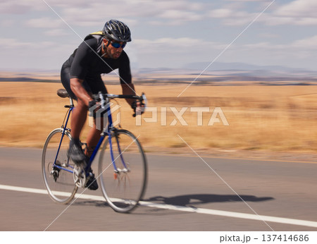 Speed, nature and man cycling on road for workout, exercise and scenic mountain path. Fitness, wellness and cyclist on fast bike on summer morning for training, practice and bicycle race with motion. Speed, nature and man cycling on road for workout, exercise and scenic mountain path. Fitness, wellness and cyclist on fast bike on summer morning for training, practice and bicycle race with motion. 137414686