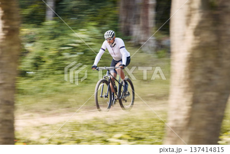 Forest blur, mountain bike and sports man cycling, action and ride bicycle for cardio, fitness or transportation. Sustainable, green nature trees and cyclist training, speed and travel in woods path 137414815