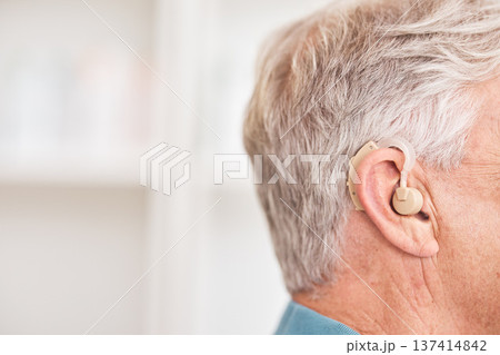 Hearing aid, closeup and ear of man with disability for medical support, help listening or healthcare at mockup space. Face of deaf patient with audiology implant for sound waves, amplifier or volume Hearing aid, closeup and ear of man with disability for medical support, help listening or healthcare at mockup space. Face of deaf patient with audiology implant for sound waves, amplifier or volume 137414842