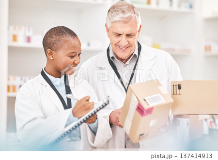 Man, woman and boxes in pharmacy for checklist, delivery schedule or stock report for medicine. Help, mentor and pharmacist team with inventory list, pharmaceutical product package with medical info. 137414913