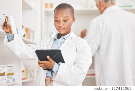 Inventory, pharmacy and black woman with a tablet, connection and research on medication or pill box for treatment. Healthcare, pharmaceutical and African person with technology or check prescription 137415069