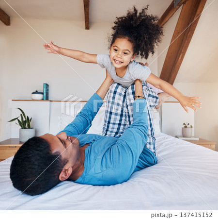 Airplane, smile and girl child with father on bed flying for fun, fantasy, and happiness in modern apartment. Family, play and face of young kid with dad in bedroom for quality time and bonding 137415152