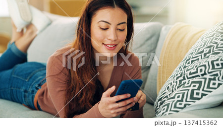 Credit card payment, phone and woman on sofa online shopping in living room buy e-commerce on sale fashion. Asian Singapore girl customer, mobile smartphone and internet banking app happy in lounge Credit card payment, phone and woman on sofa online shopping in living room buy e-commerce on sale fashion. Asian Singapore girl customer, mobile smartphone and internet banking app happy in lounge 137415362