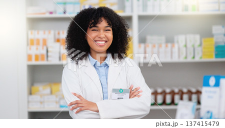 Portrait of a pharmacist with folded arms against a background of prescription medication. Happy young professional health care worker waiting to diagnose and prescribe pills at a clinic dispensary Portrait of a pharmacist with folded arms against a background of prescription medication. Happy young professional health care worker waiting to diagnose and prescribe pills at a clinic dispensary 137415479