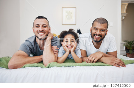Gay, happy family and a child on a bed at home with love, care and safety in a bedroom. Lgbtq men, adoption and interracial parents with foster girl kid together in morning with a smile and happiness Gay, happy family and a child on a bed at home with love, care and safety in a bedroom. Lgbtq men, adoption and interracial parents with foster girl kid together in morning with a smile and happiness 137415500