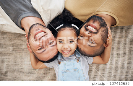 Portrait, gay dad and blended family with a girl lying together on the floor of the home for adoption from above. LGBT love, children or kids and a daughter with her happy foster parents in the house Portrait, gay dad and blended family with a girl lying together on the floor of the home for adoption from above. LGBT love, children or kids and a daughter with her happy foster parents in the house 137415683