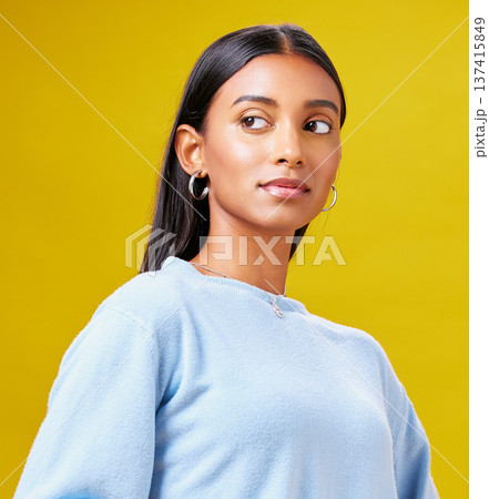 Beauty, fashion and thinking with an indian woman on a yellow background in studio for trendy style. Mindset, idea and clothes with a young gen z model posing in clothes outfit for a magazine Beauty, fashion and thinking with an indian woman on a yellow background in studio for trendy style. Mindset, idea and clothes with a young gen z model posing in clothes outfit for a magazine 137415849