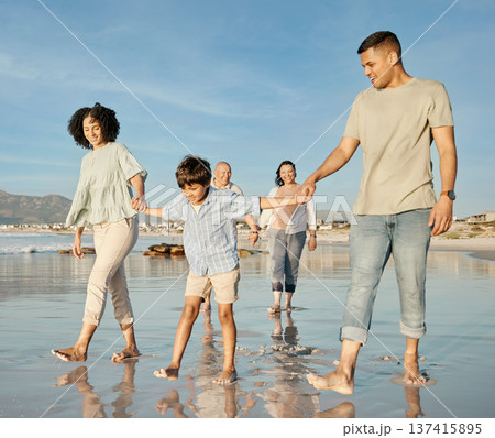 Love, kids and a family walking on the beach together for summer vacation or holiday in nature. Sky, freedom or travel with grandparents, parents and children outdoor for summer bonding by the ocean 137415895