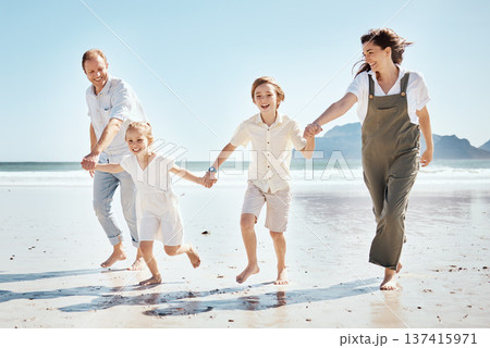 Happy family, holding hands and playing on beach in holiday, weekend or outdoor bonding together. Father, mother and children smile in happiness for summer vacation or fun on ocean coast in nature Happy family, holding hands and playing on beach in holiday, weekend or outdoor bonding together. Father, mother and children smile in happiness for summer vacation or fun on ocean coast in nature 137415971