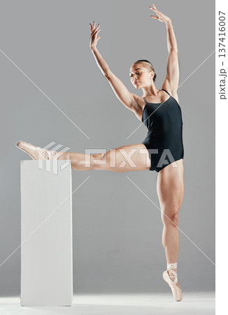 Balance, ballet or leg of woman on block in studio in creative or elegant performance for freedom. Stretching, dancer or girl ballerina ready for dancing or training to exercise on white background 137416007