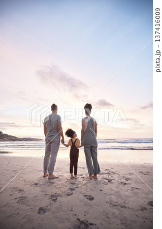 Back view, family at beach and holding hands at sunset, bonding or fun outdoor on mockup space. Rear, sea and father, kid and mother at ocean in interracial care, summer holiday or vacation to travel Back view, family at beach and holding hands at sunset, bonding or fun outdoor on mockup space. Rear, sea and father, kid and mother at ocean in interracial care, summer holiday or vacation to travel 137416009