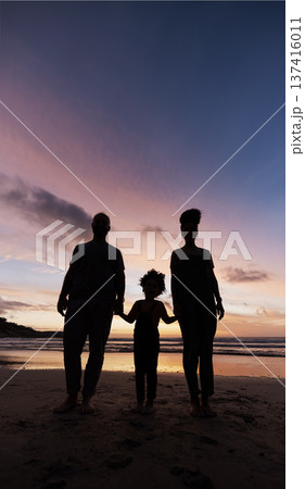 Silhouette, family at beach and holding hands at sunset, bonding or outdoor on mockup space. Shadow, sea and father, kid and mother at ocean in care, summer holiday or vacation to travel together Silhouette, family at beach and holding hands at sunset, bonding or outdoor on mockup space. Shadow, sea and father, kid and mother at ocean in care, summer holiday or vacation to travel together 137416011