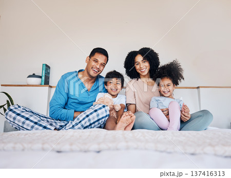 Happy, smile and portrait of a family on a bed together for bonding or connection at home. Happiness, excited and young children with their parents from Colombia in the room of their modern house. Happy, smile and portrait of a family on a bed together for bonding or connection at home. Happiness, excited and young children with their parents from Colombia in the room of their modern house. 137416313