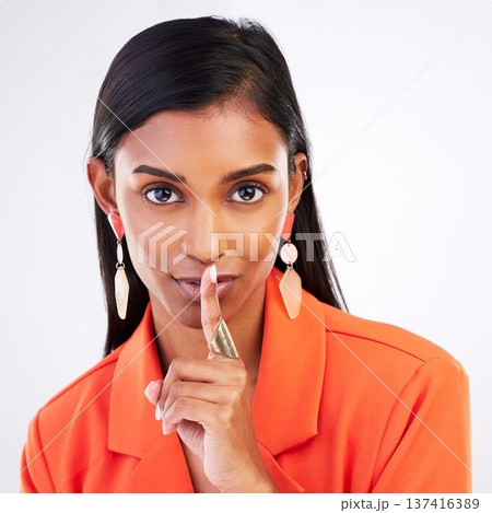 Secret, portrait and woman in studio with finger on the lips for silence, quiet and hush news on white background. whisper, emoji and female model face with confidential, privacy or drama gossip Secret, portrait and woman in studio with finger on the lips for silence, quiet and hush news on white background. whisper, emoji and female model face with confidential, privacy or drama gossip 137416389