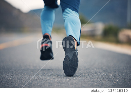 Street, legs and fitness person running for outdoor exercise, cardio workout or training for marathon race on asphalt road. Sports shoes, athlete foot steps or feet of closeup runner doing challenge 137416510
