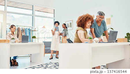 Designer group, workshop and fashion startup with computer, talking and planning with ideas, creativity or goals. Women, company and teamwork with fabric, clothes and support for vision in Cape Town 137416544