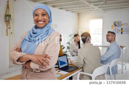 Ceo, Muslim woman and arms crossed portrait of business manager in a office with a smile. Company leader, management and mature female professional with a hijab ready for a website team meeting Ceo, Muslim woman and arms crossed portrait of business manager in a office with a smile. Company leader, management and mature female professional with a hijab ready for a website team meeting 137416698