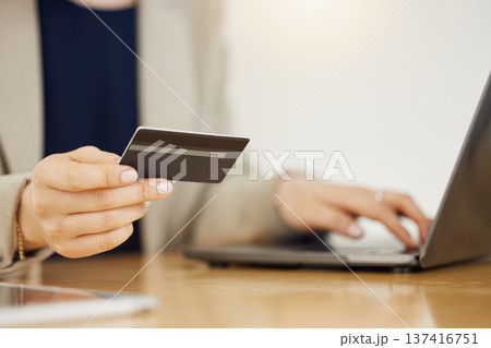 Banking, credit card and hands of business woman with payment on a internet or banking on a laptop. Online, loan and corporate professional or customer use rewards to purchase on ecommerce website Banking, credit card and hands of business woman with payment on a internet or banking on a laptop. Online, loan and corporate professional or customer use rewards to purchase on ecommerce website 137416751