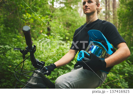 Mountain bike, man and helmet, nature and sports with adventure and fitness in forest. Cycling outdoor, biker and travel with athlete, exercise training and ready to ride, bicycle and challenge Mountain bike, man and helmet, nature and sports with adventure and fitness in forest. Cycling outdoor, biker and travel with athlete, exercise training and ready to ride, bicycle and challenge 137416925
