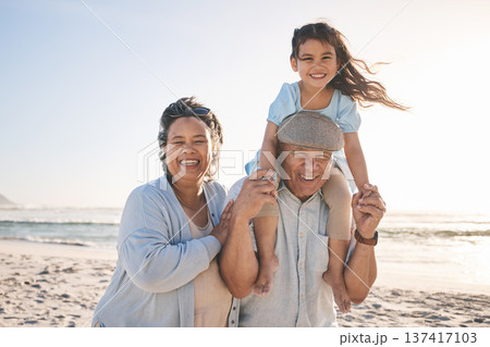 Happy, beach and portrait of girl with her grandparents on a tropical family vacation or adventure. Smile, sunset and kid bonding with her grandmother and grandfather by the ocean on holiday together Happy, beach and portrait of girl with her grandparents on a tropical family vacation or adventure. Smile, sunset and kid bonding with her grandmother and grandfather by the ocean on holiday together 137417103