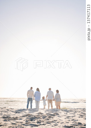 Love, travel and holding hands with big family on beach for vacation, bonding and summer. Freedom, care and relax with group of people walking at seaside holiday for generations, happiness and mockup Love, travel and holding hands with big family on beach for vacation, bonding and summer. Freedom, care and relax with group of people walking at seaside holiday for generations, happiness and mockup 137417113