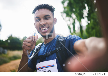 Runner man, athlete and outdoor in selfie, race or excited for triathlon, hiking or adventure in woods. Young African guy, happy and photography for memory, profile picture or post for social network 137417171