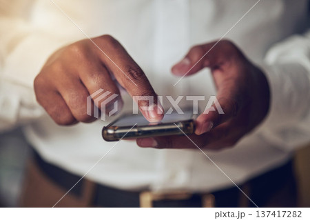 Hands, app and phone for communication with a business person closeup for networking or browsing. Mobile, contact and social media with an employee scrolling on a touchscreen to search the internet 137417282