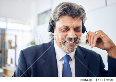 Senior businessman, call center and consulting in customer service, support or financial advisor at office. Mature man, consultant or agent smile with headphones in online advice or help at workplace Senior businessman, call center and consulting in customer service, support or financial advisor at office. Mature man, consultant or agent smile with headphones in online advice or help at workplace 137417696