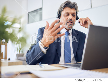 Business man, call center and computer for consultant in communication, sales or virtual meeting. Corporate agent, financial advisor or manager speaking on laptop or video for work from home webinar Business man, call center and computer for consultant in communication, sales or virtual meeting. Corporate agent, financial advisor or manager speaking on laptop or video for work from home webinar 137417698