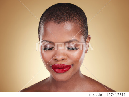 Face, beauty and a makeup of a black woman in studio for skin care, glow and cosmetics. Headshot of african person or aesthetic model for facial shine, dermatology or red lipstick on beige background Face, beauty and a makeup of a black woman in studio for skin care, glow and cosmetics. Headshot of african person or aesthetic model for facial shine, dermatology or red lipstick on beige background 137417711