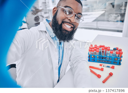 Scientist, selfie and man with blood research and happy from medical and healthcare work. African male doctor, portrait and profile picture for social media and chemistry test in a science laboratory Scientist, selfie and man with blood research and happy from medical and healthcare work. African male doctor, portrait and profile picture for social media and chemistry test in a science laboratory 137417896