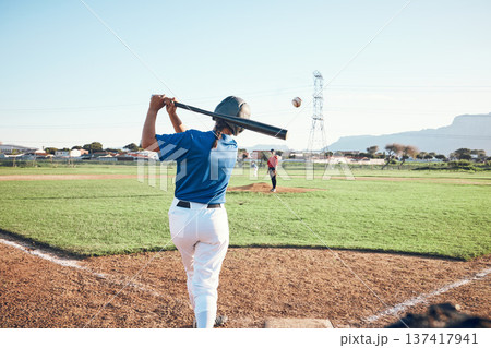 Baseball, bat and person swing at ball outdoor on a pitch for sports, performance and competition. Behind athlete or softball player ready for game, training or exercise challenge at field or stadium 137417941