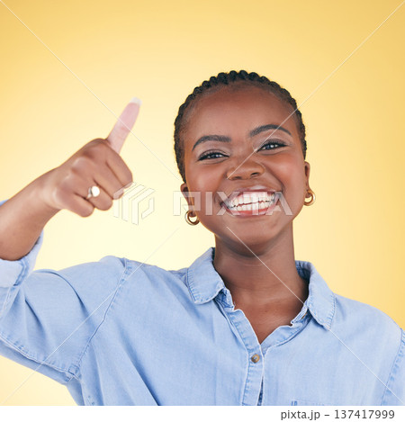 Black woman, happy in portrait and thumbs up, feedback and support isolated on yellow background. Happy, agreement and hand gesture with positive review, yes and like emoji with success in a studio Black woman, happy in portrait and thumbs up, feedback and support isolated on yellow background. Happy, agreement and hand gesture with positive review, yes and like emoji with success in a studio 137417999