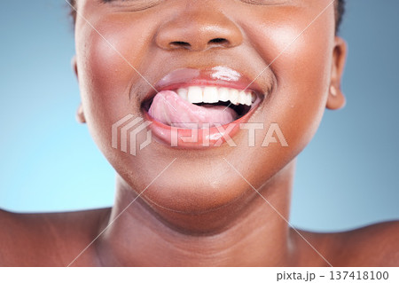 Woman, lips or closeup tongue on dental teeth, blue background or studio of cosmetic veneers results. Emoji, model or fun facial expression in wellness, gum or clean mouth hygiene in grooming routine 137418100