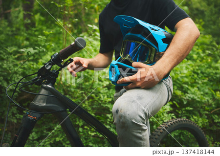 Mountain bike, man and helmet, forest and sports with adventure and fitness in nature outdoor. Cycling, biker and travel with athlete, exercise training and ready to ride, bicycle and challenge Mountain bike, man and helmet, forest and sports with adventure and fitness in nature outdoor. Cycling, biker and travel with athlete, exercise training and ready to ride, bicycle and challenge 137418144
