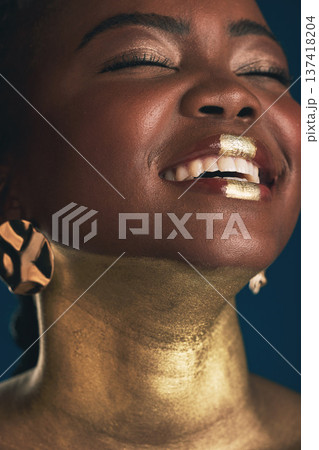 Smile, gold and makeup with face of black woman in studio for creative, luxury and cosmetics. Glow, glamour art and beauty with model on dark background for elegant, skincare and salon treatment 137418204