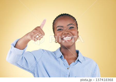 Black woman, portrait and thumbs up, feedback and support with smile isolated on yellow background. Happy, agreement and hand gesture with positive review, yes and like emoji with success in a studio Black woman, portrait and thumbs up, feedback and support with smile isolated on yellow background. Happy, agreement and hand gesture with positive review, yes and like emoji with success in a studio 137418368