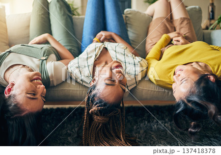 Upside down, friends and relax on sofa together with head hanging on couch and smile with happiness in home on weekend. Group, diversity and women laughing in fun, bonding or laying on chair in house Upside down, friends and relax on sofa together with head hanging on couch and smile with happiness in home on weekend. Group, diversity and women laughing in fun, bonding or laying on chair in house 137418378